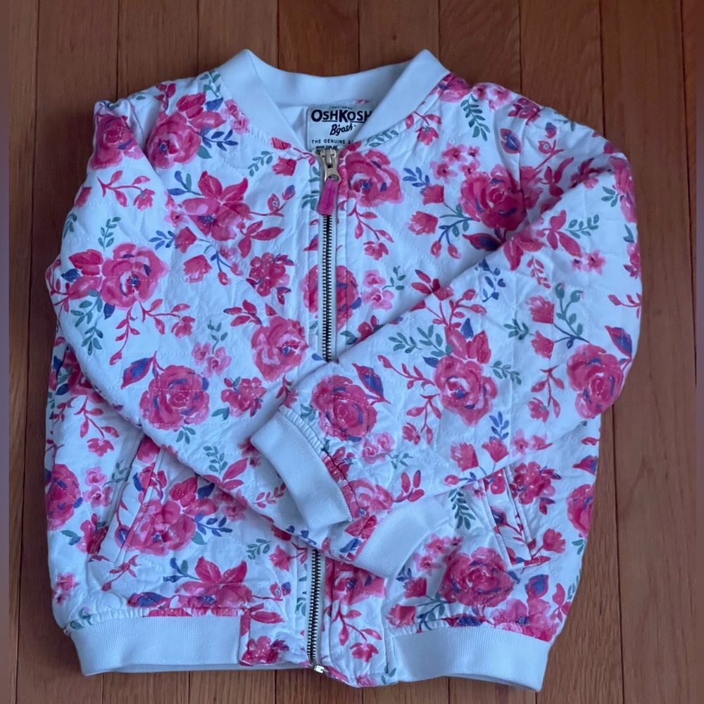 Selling girl jacket with floral design, size 7 in girls.